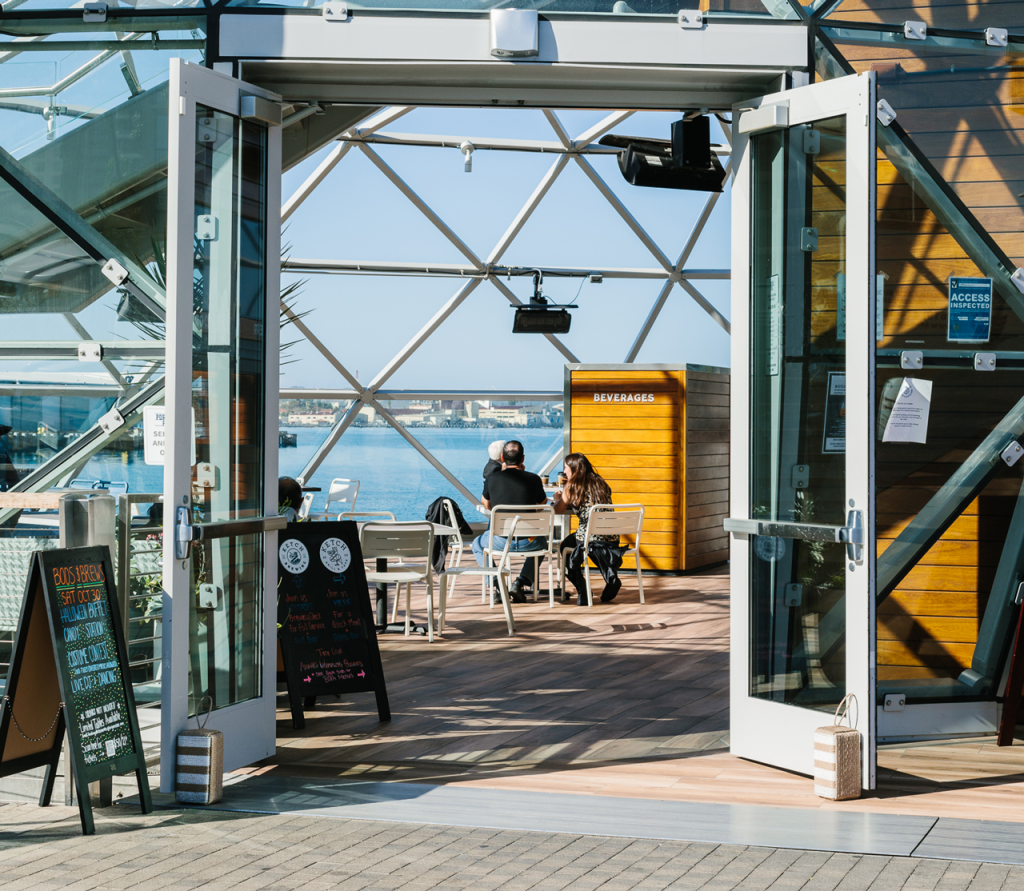 front entrance to ketch at portside pier on a sunny day